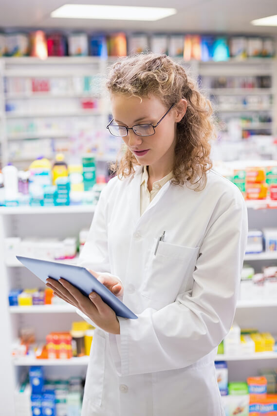 Pharmacist using tablet pc at the hospital pharmacy